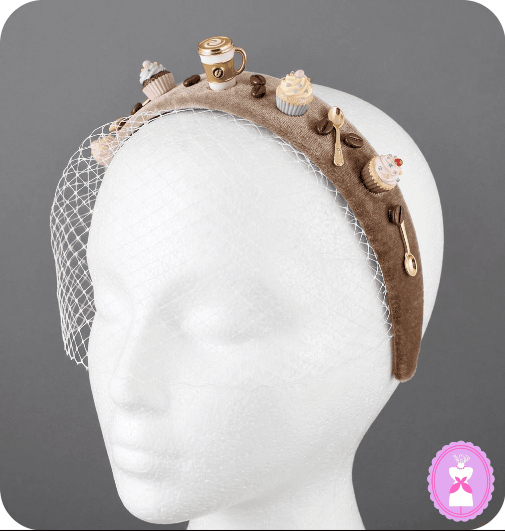 Coffee and cupcake-inspired Lush Fascinator displayed on a mannequin